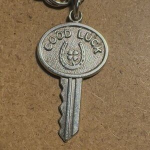 Vintage Sterling good luck key charm